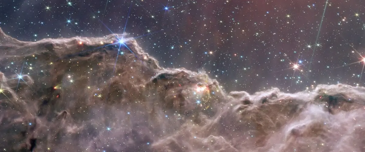 “Cosmic Cliffs” in the Carina Nebula (NIRCam and MIRI Composite Image) (weic2205b)